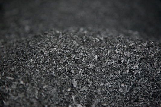 Photo of a pile of biochar carbon